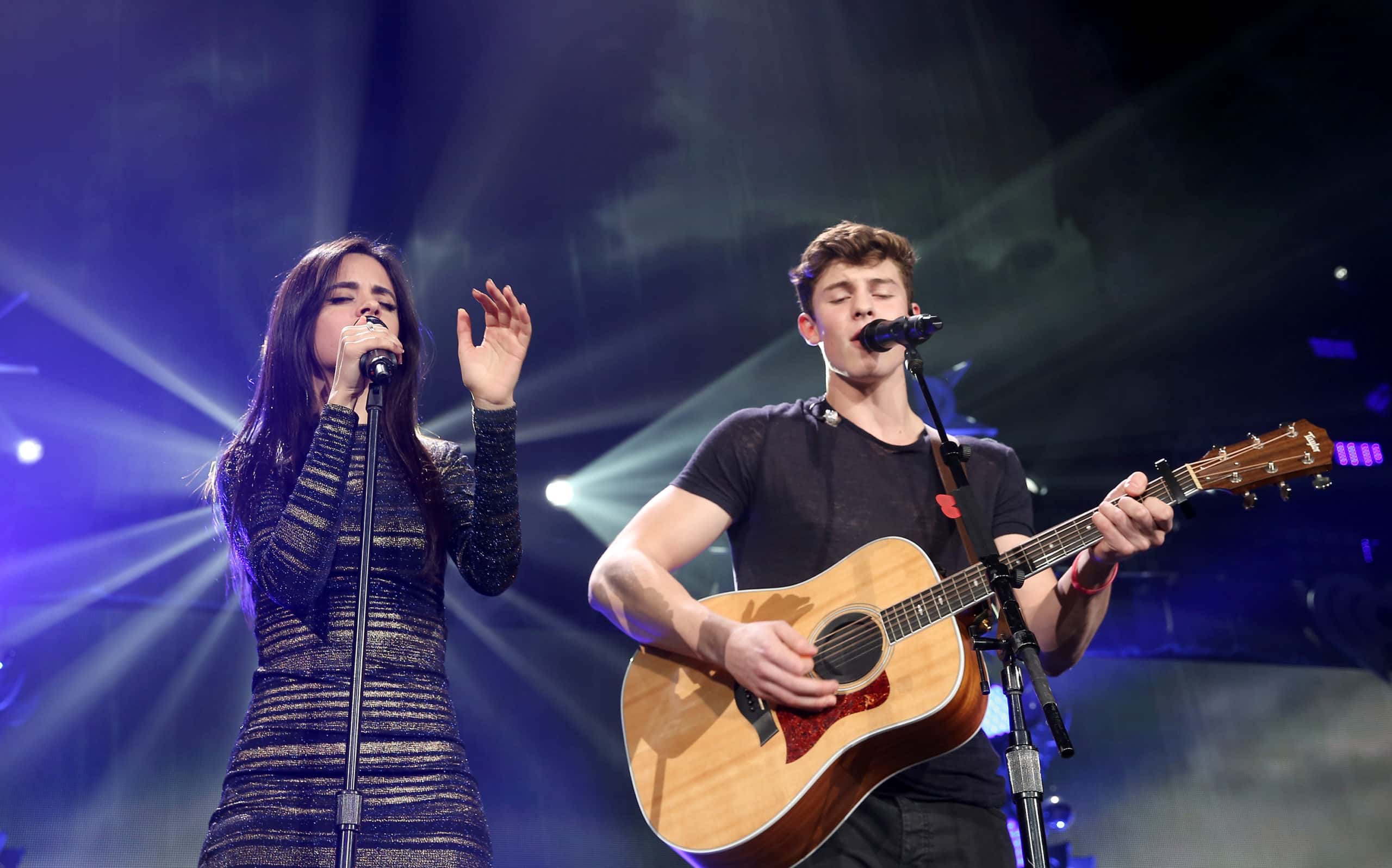  Singer Camila Cabello of Fifth Harmony (L) performs with musician Shawn Mendes