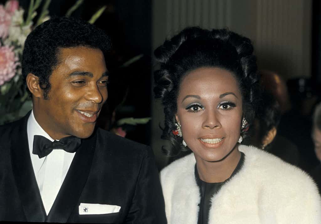 Diahann Carroll wearing white clothes and Don Marshall wearing black suit
