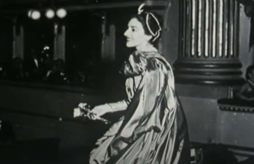 Grayscale Profile Photo of Maria Callas wearing a shiny dress, looking to the left