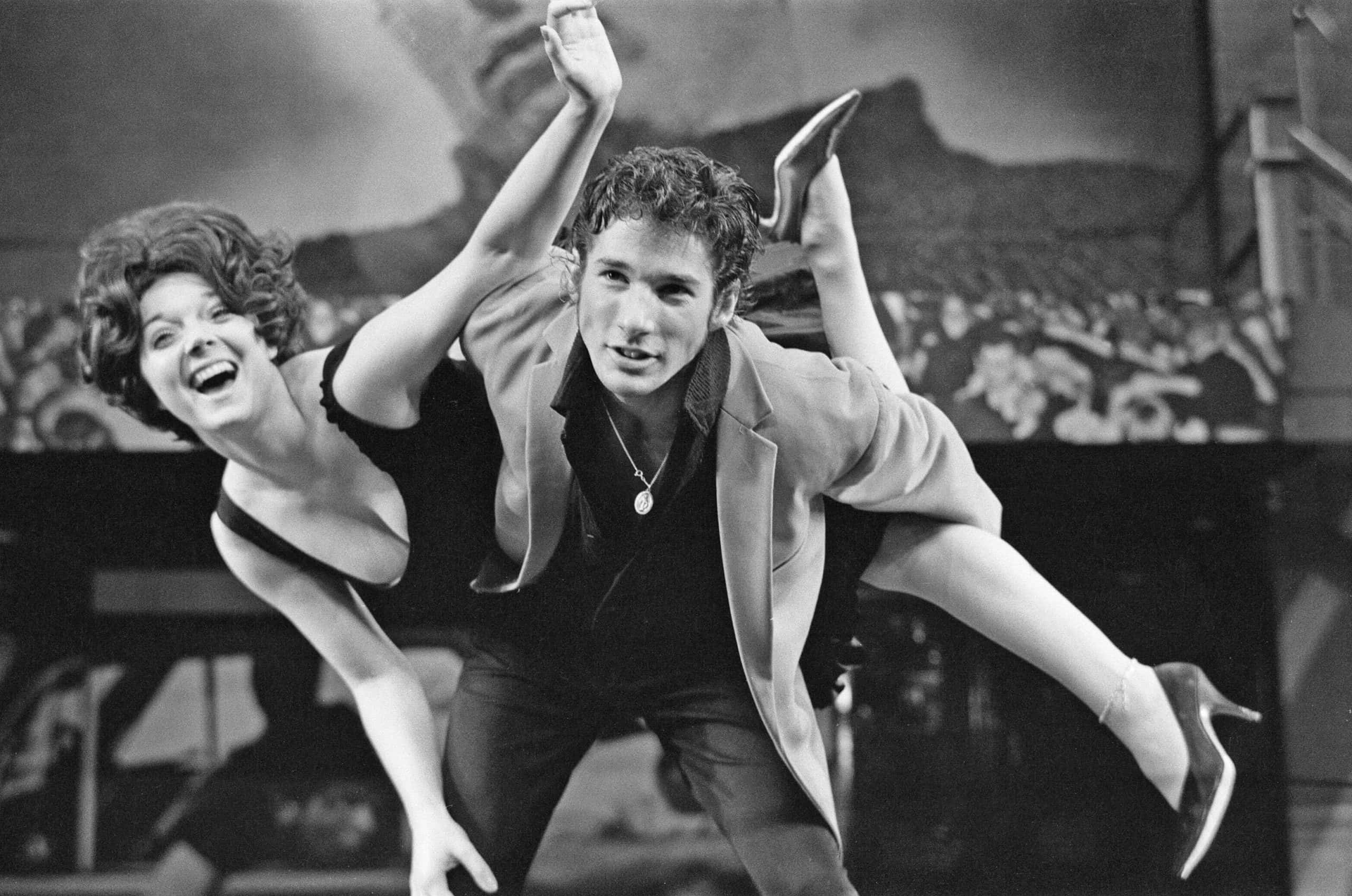 American musical Grease, Leading the cast is Richard Gere with Stacey Gregg