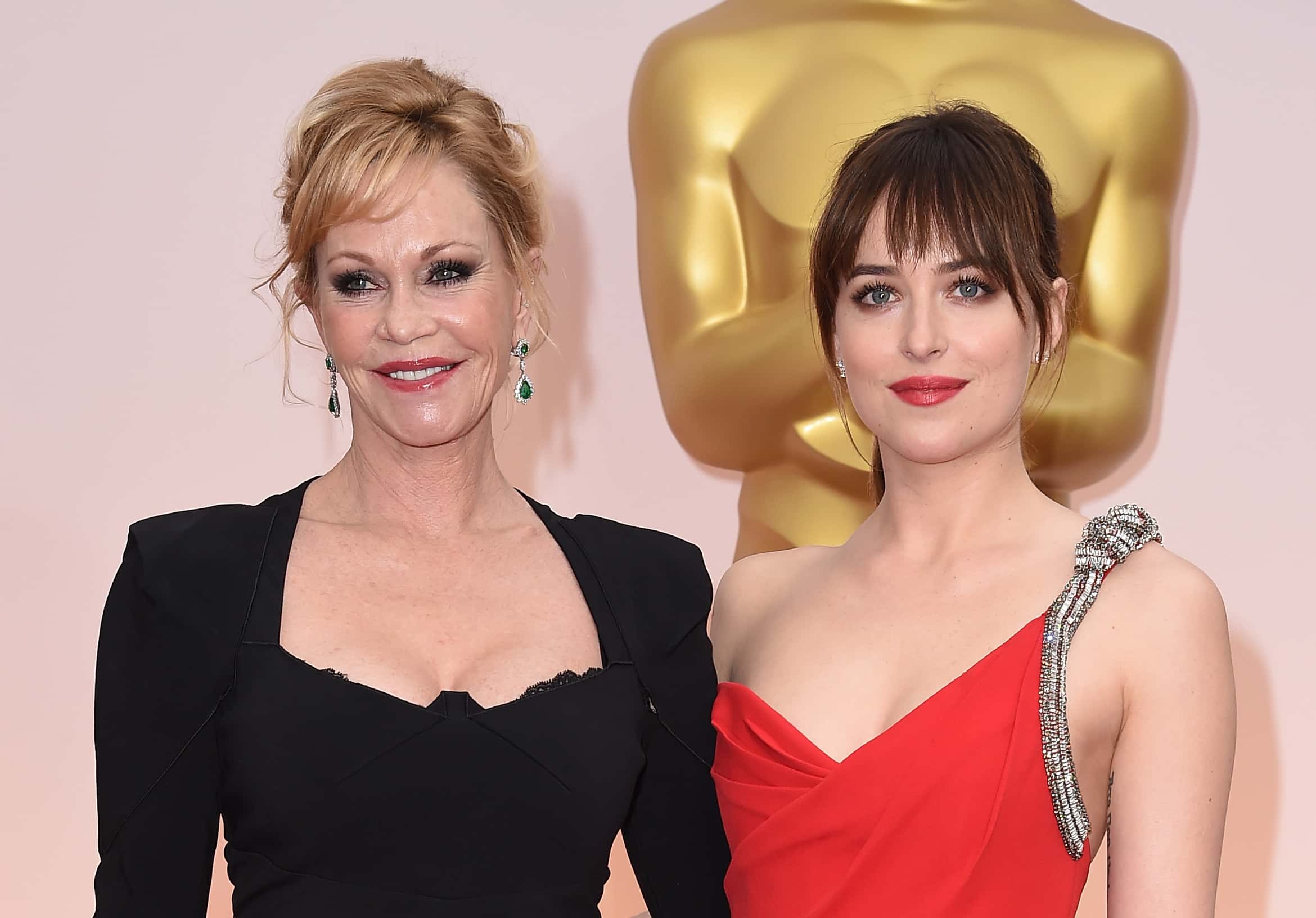 Actresses Melanie Griffith (L) and Dakota Johnson attend the 87th Annual Academy Awards
