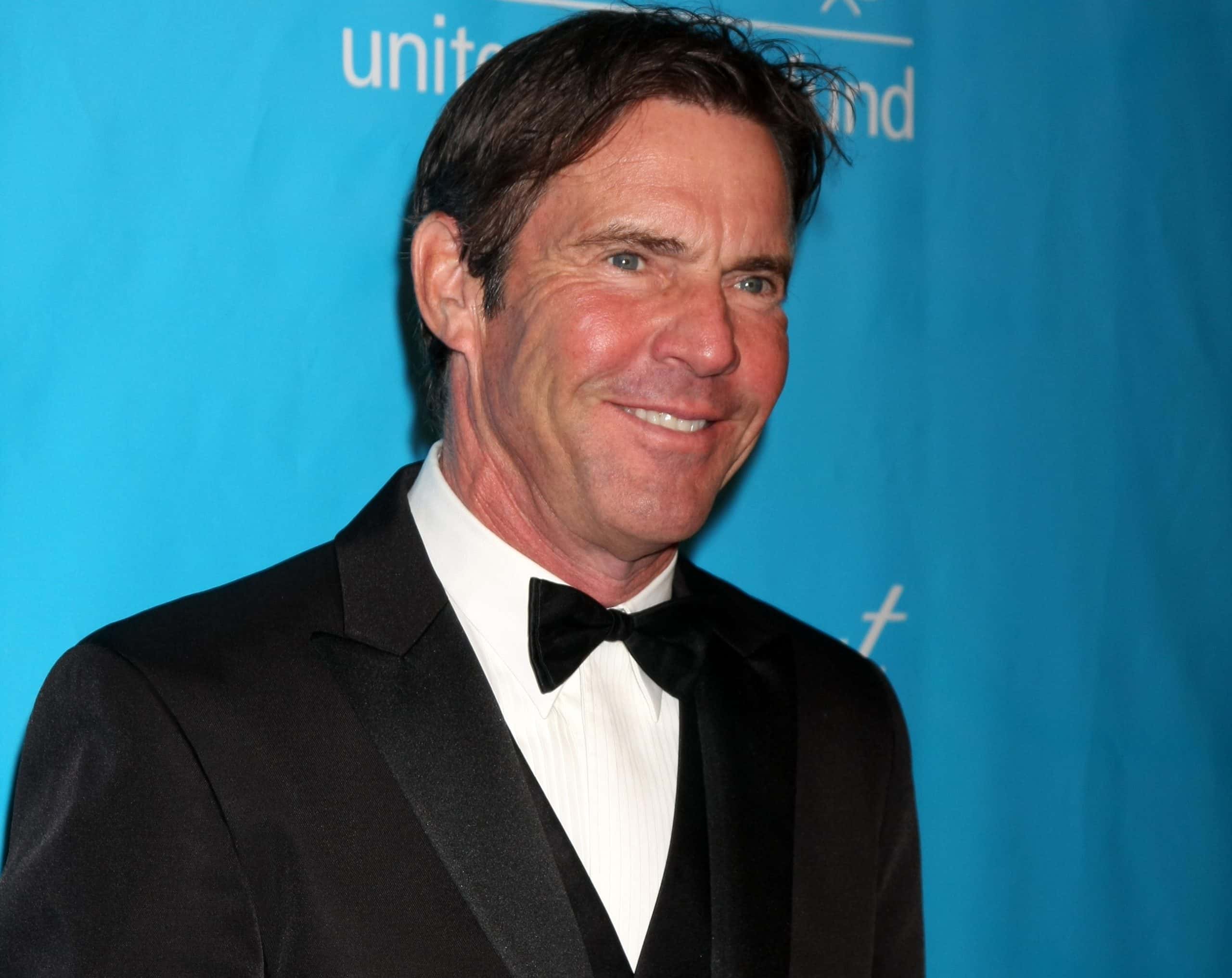 Dennis Quaid in a black suit