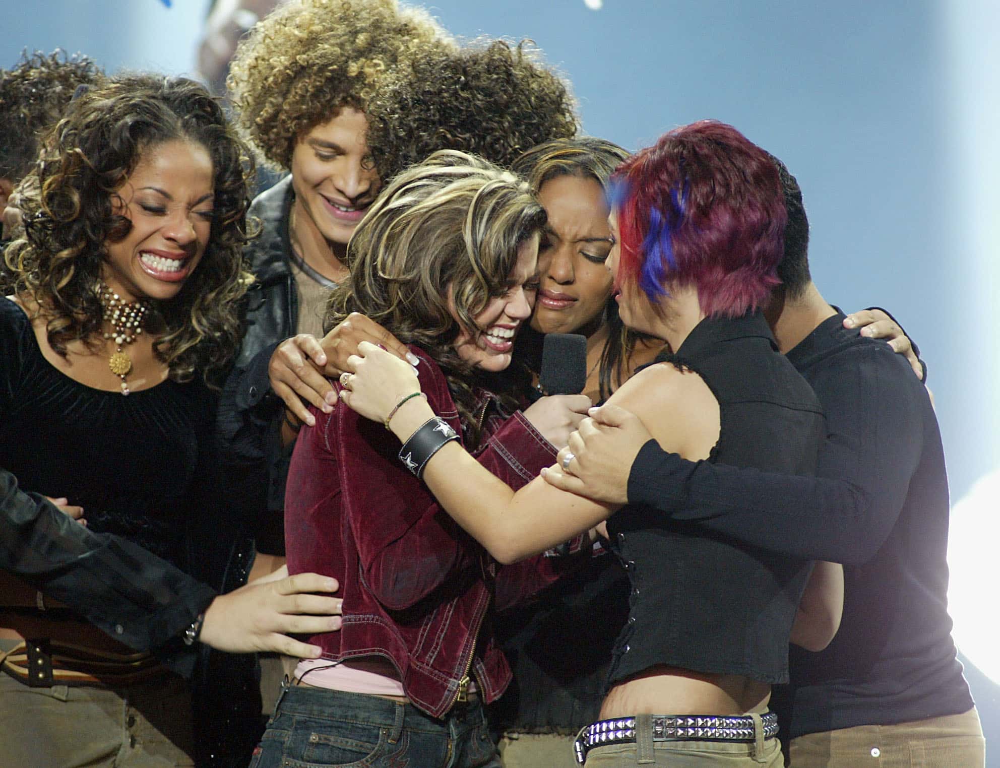 American Idol winner Kelly Clarkson embraces Idol contestants at the Kodak Theatre in Hollywood, Ca., Sept. 4, 2002. 