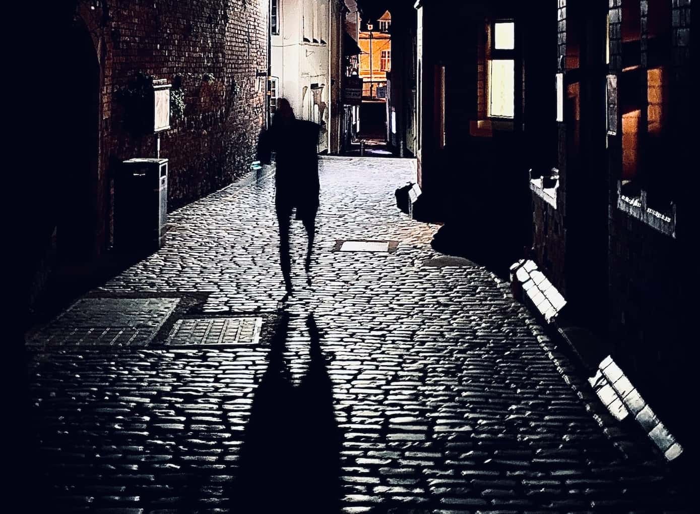 Sam Pearce-Warrilow, man running on the street in dark.