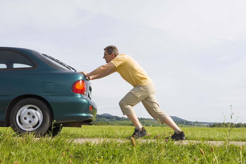 Man push broken car