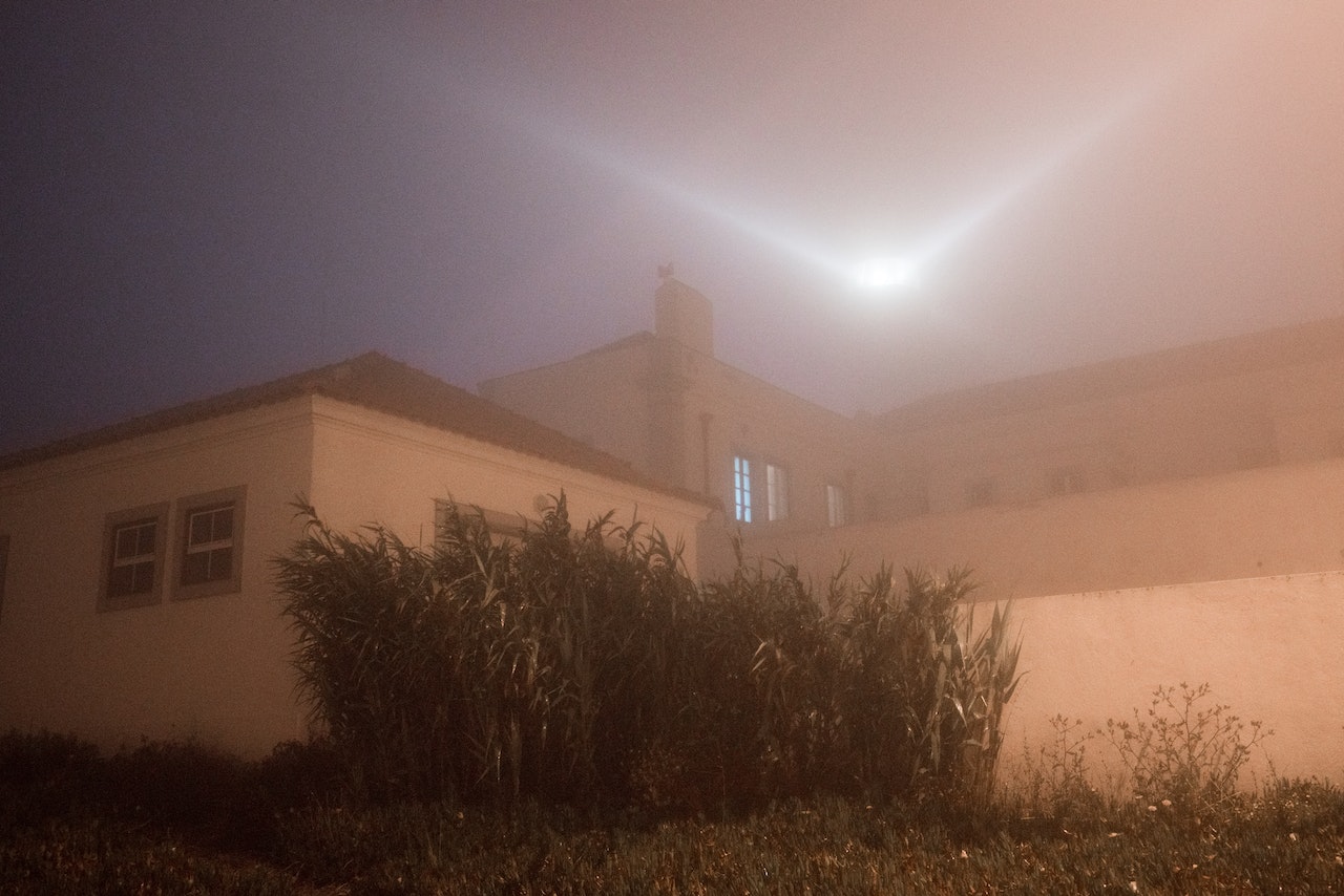 Big bright light in sky above building