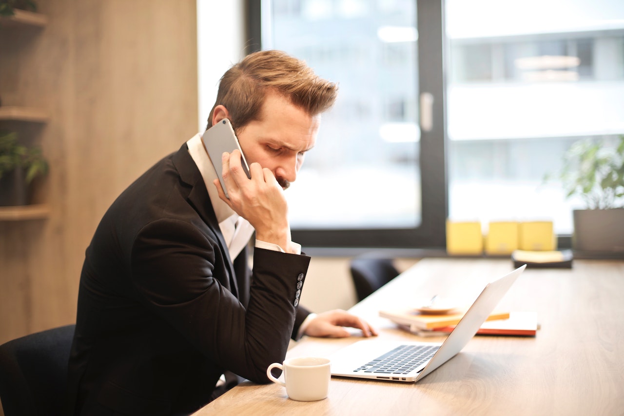 Man at phone in office