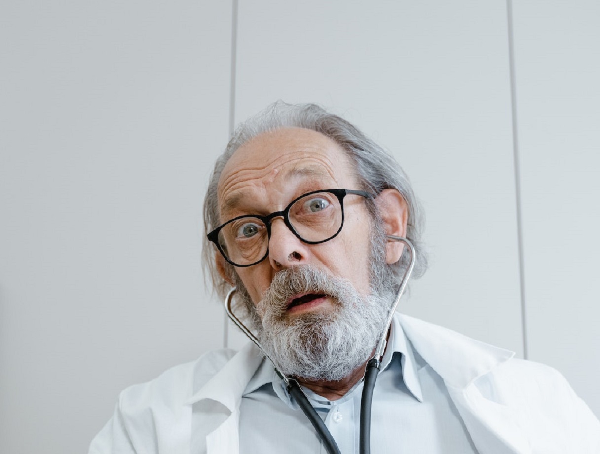 Surprised doctor looking at camera.