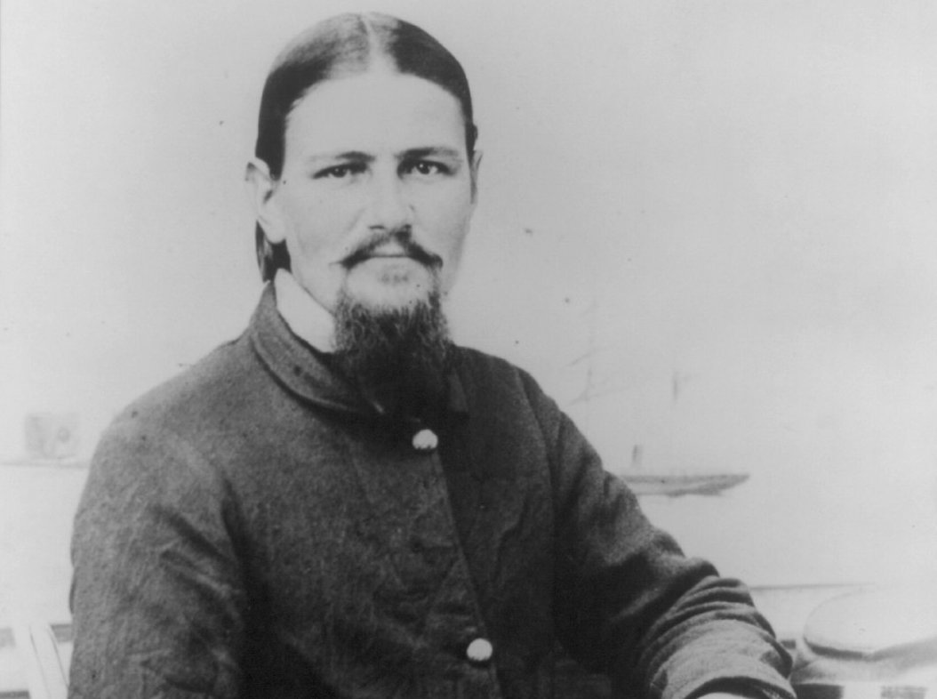 Boston Corbett, half-length portrait, seated