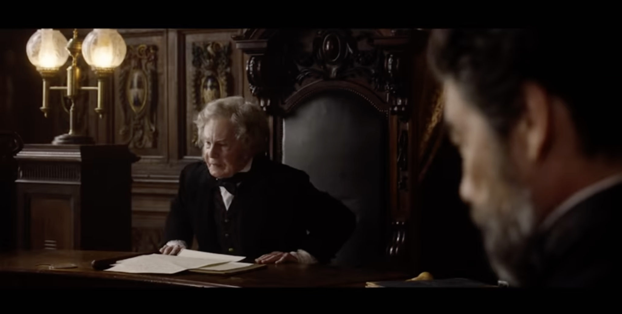 A British official sitting at a desk