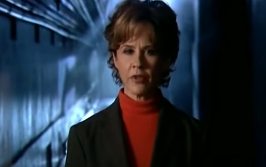 LINDA BLAIR as a host of Scariest Places on Earth in red turtleneck 