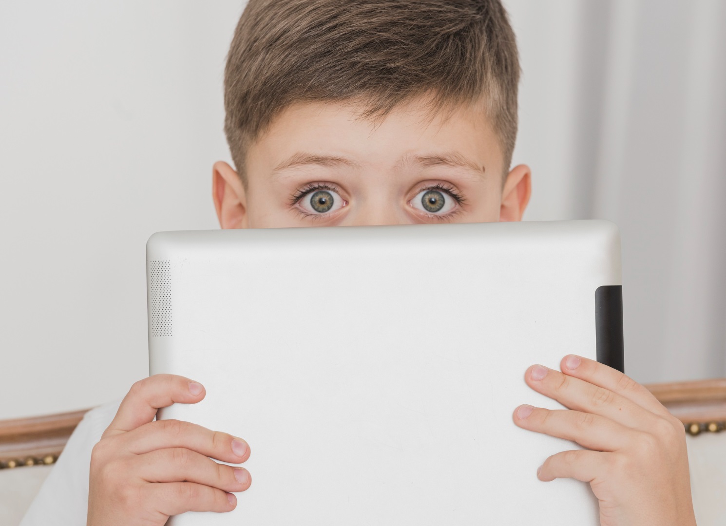 Kid holding a tablet