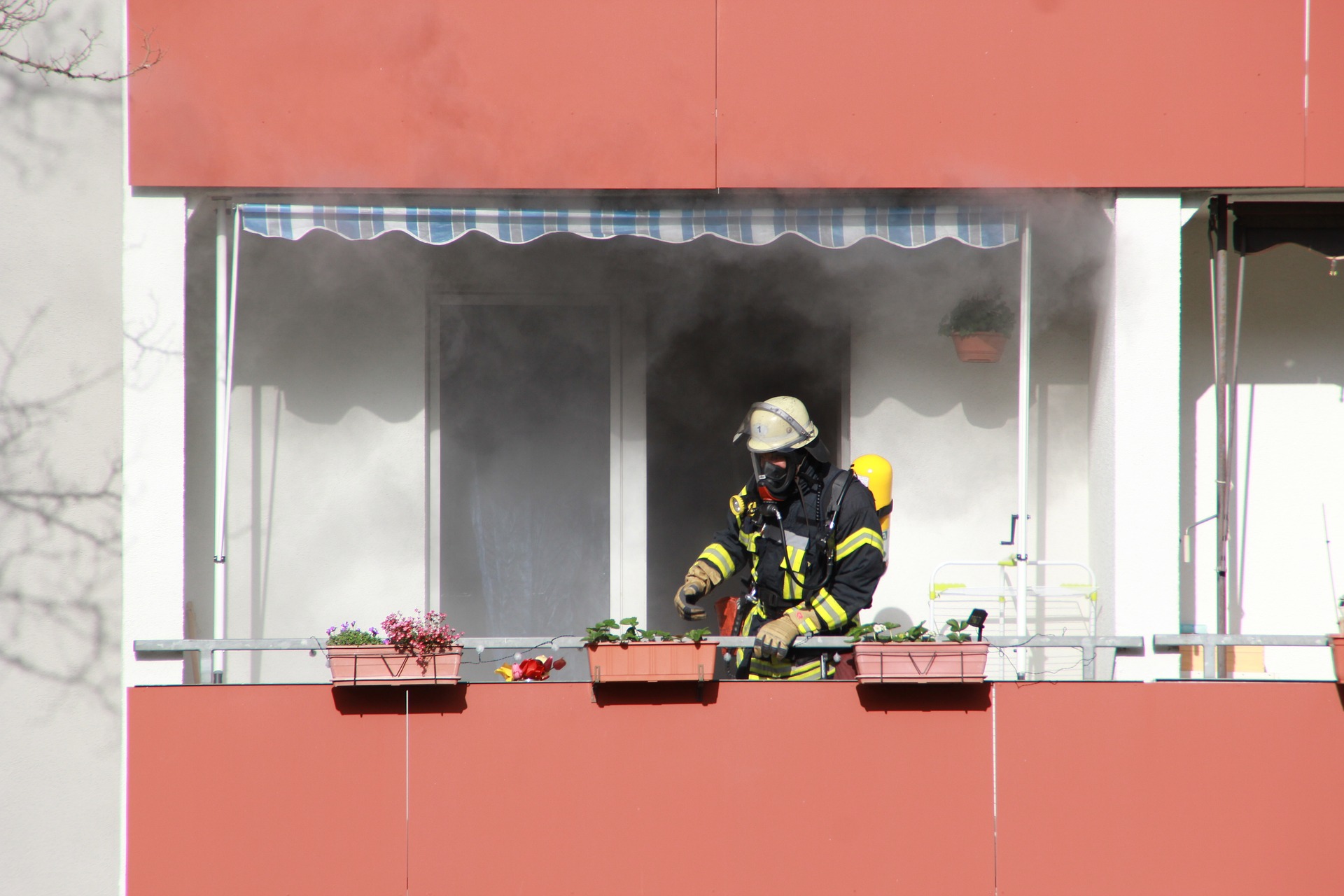 Firefighter putting out fire in apartment 