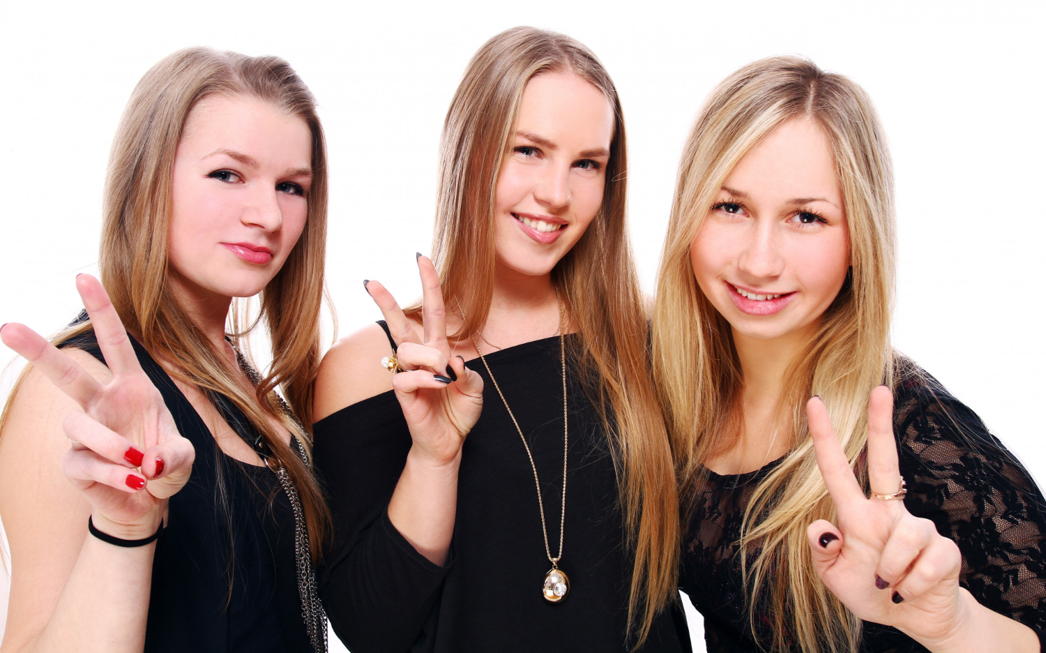 Three woman wearing black dresses