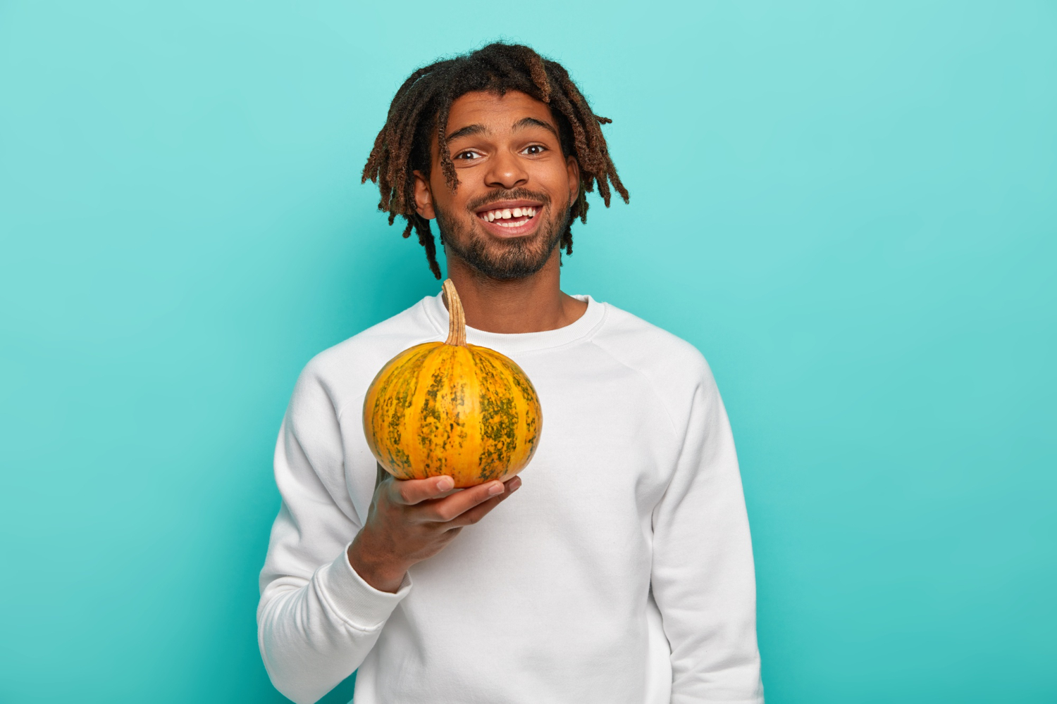 Man holding a pumpkin