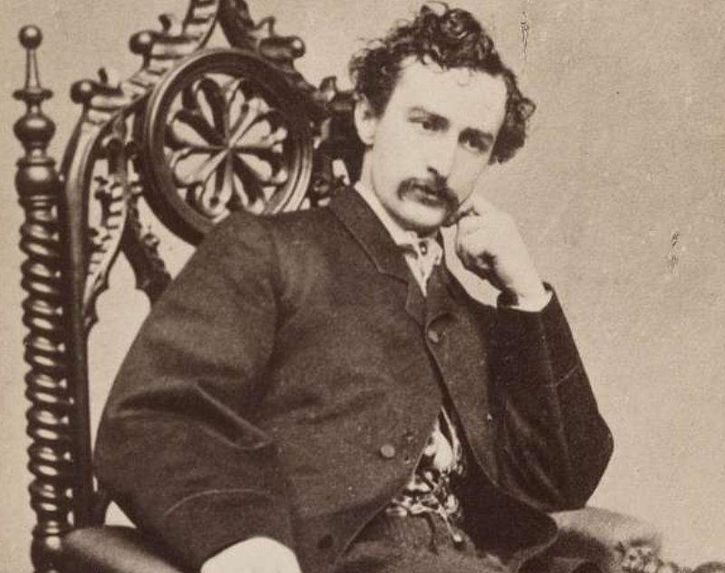  American actor John Wilkes Booth sitting on a chair