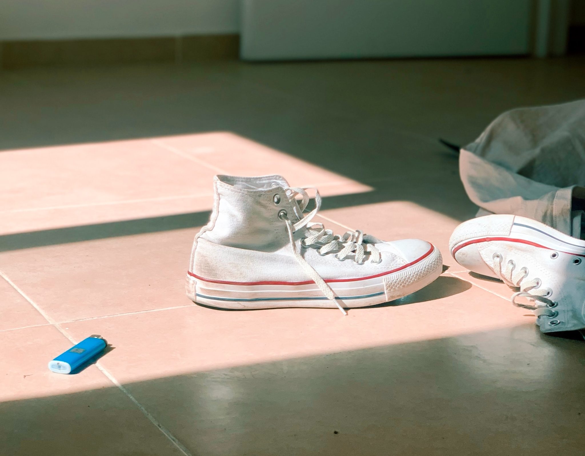 Blue lighter on the floor.