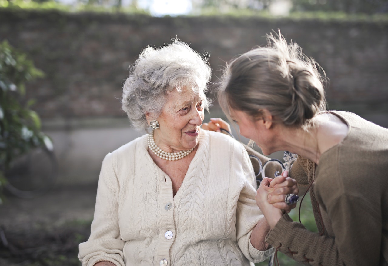 Two adult women talking