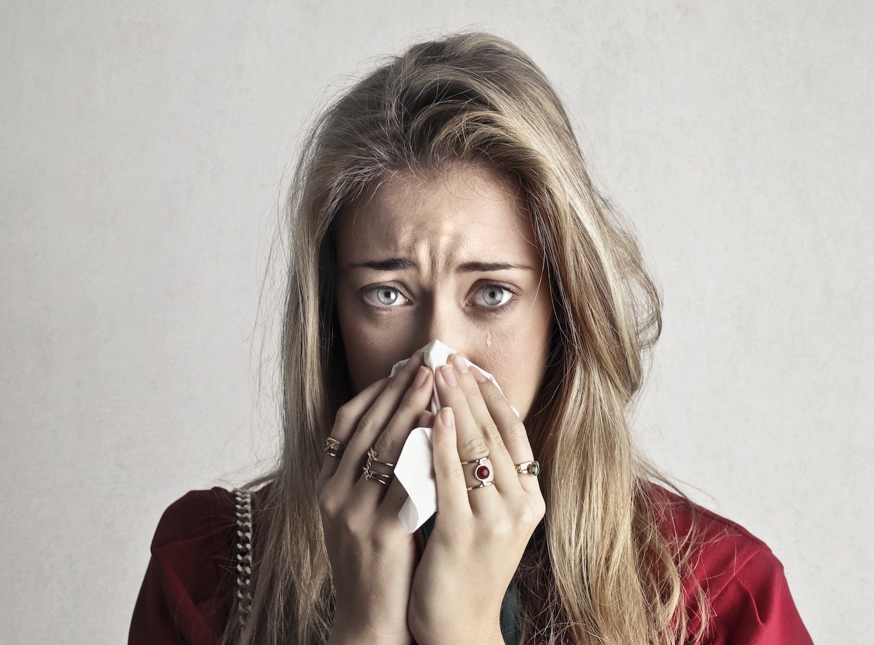 Crying woman in red long sleeve shirt