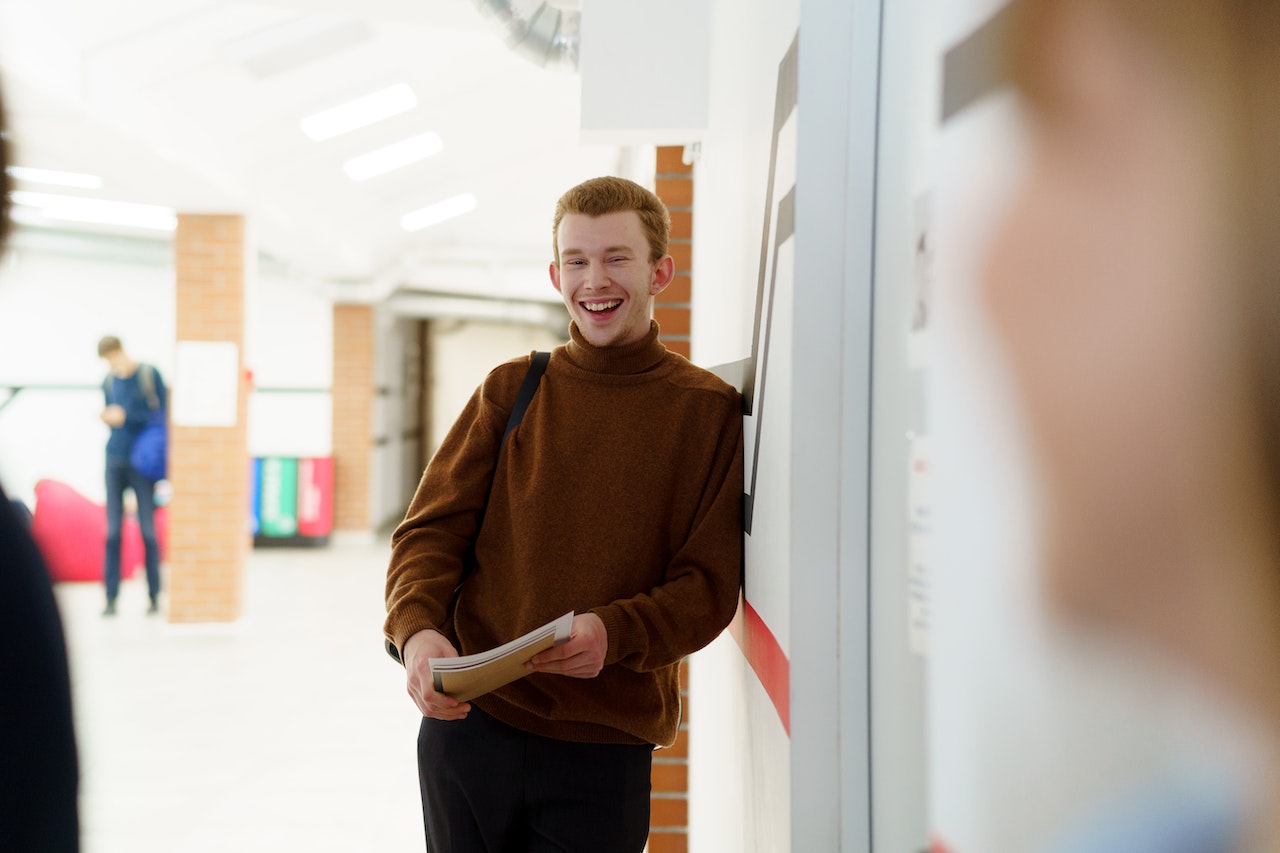 Smiling teenager in school hallway