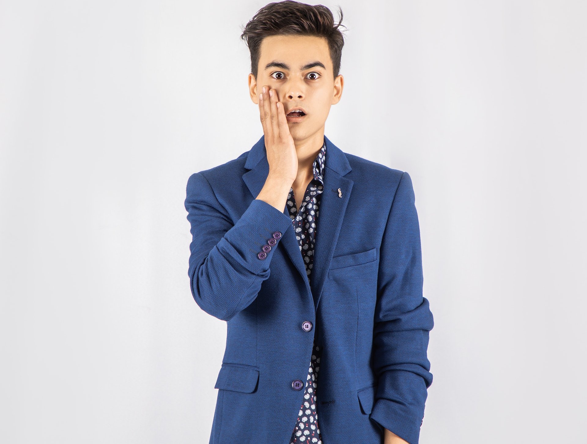 Shocked man in a blue suit