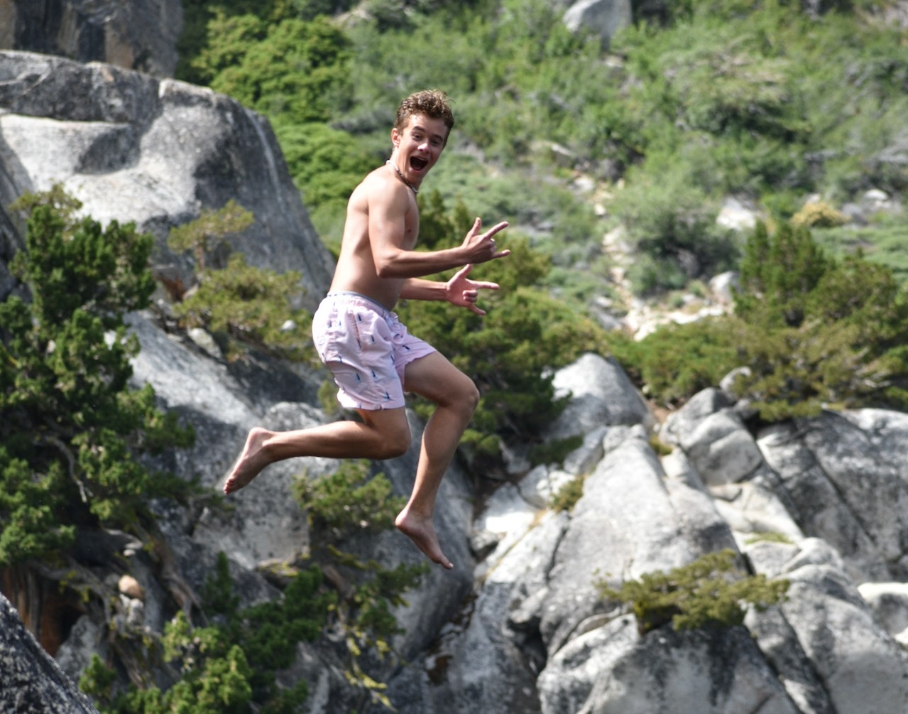 Man jumping from a cliff.