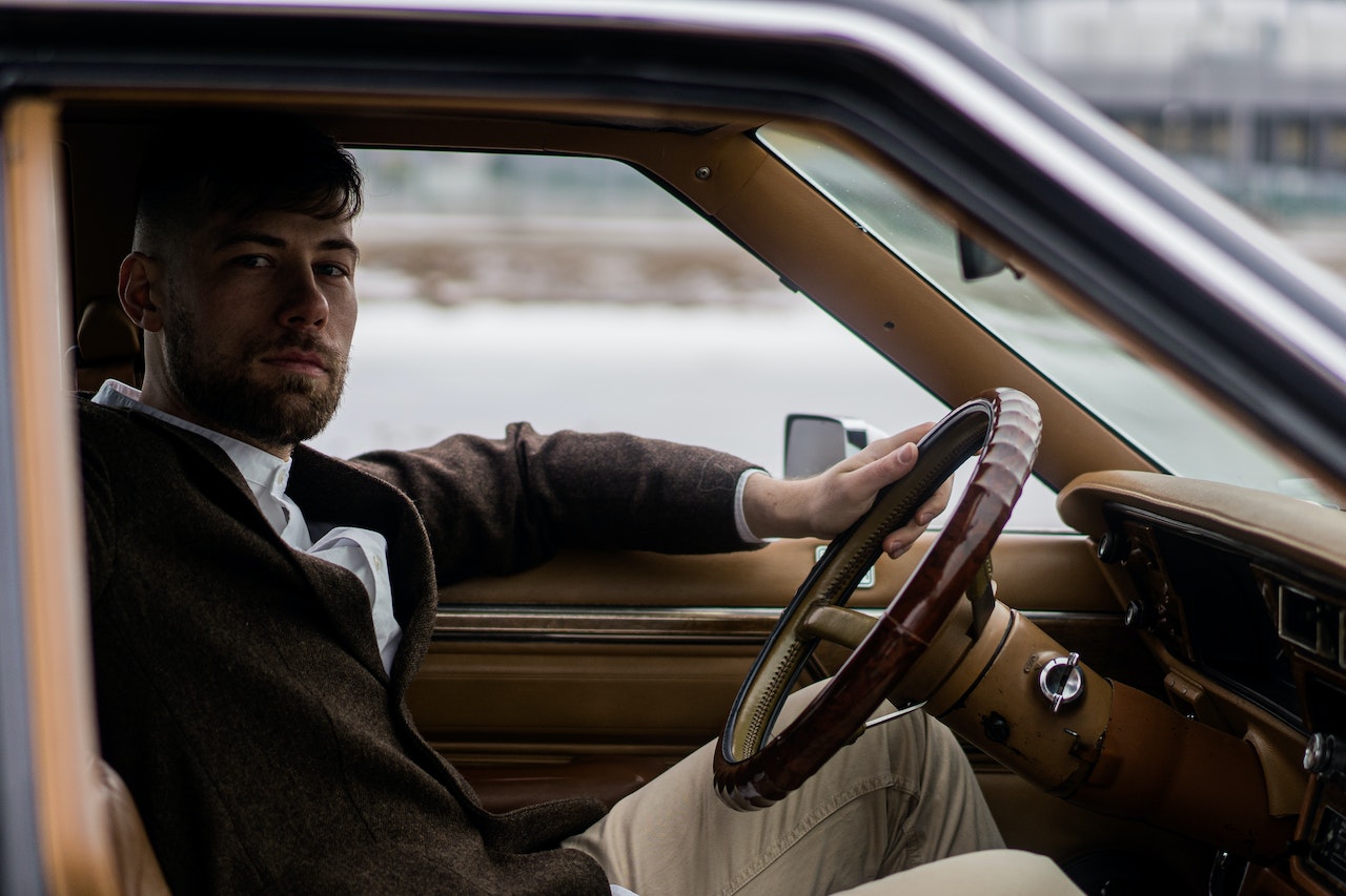 Man sitting in car
