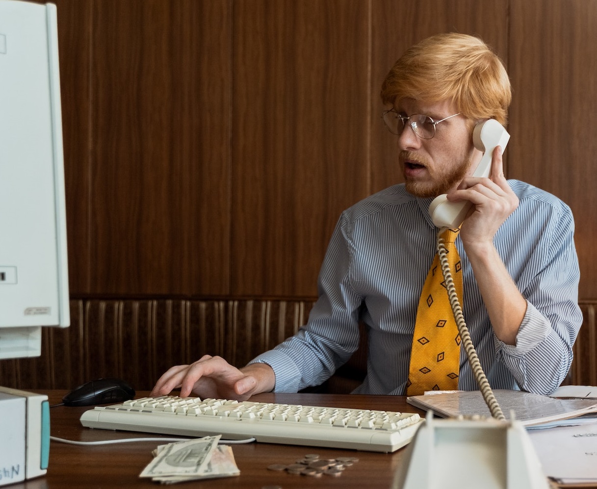 Man talking on a telephone.