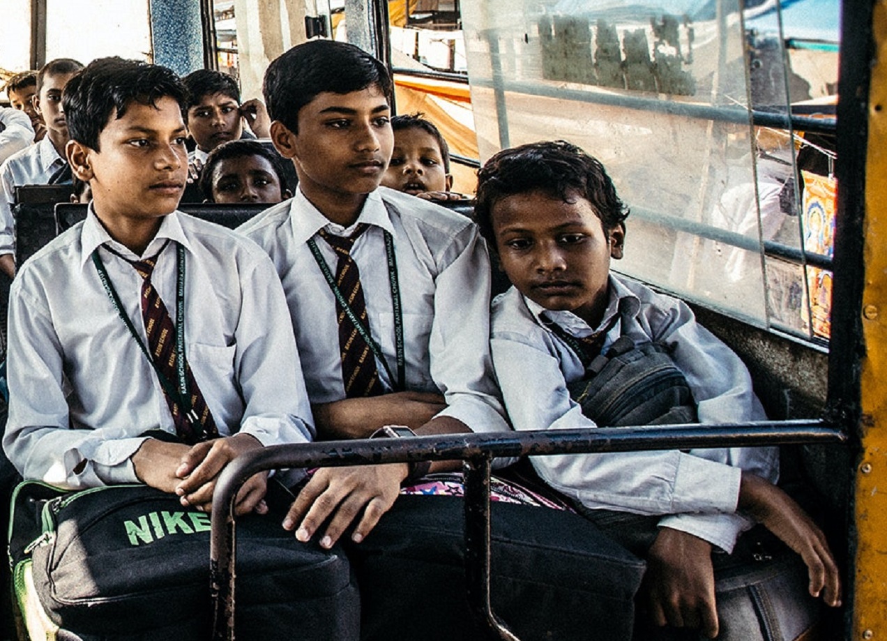 Students seating inside a bus