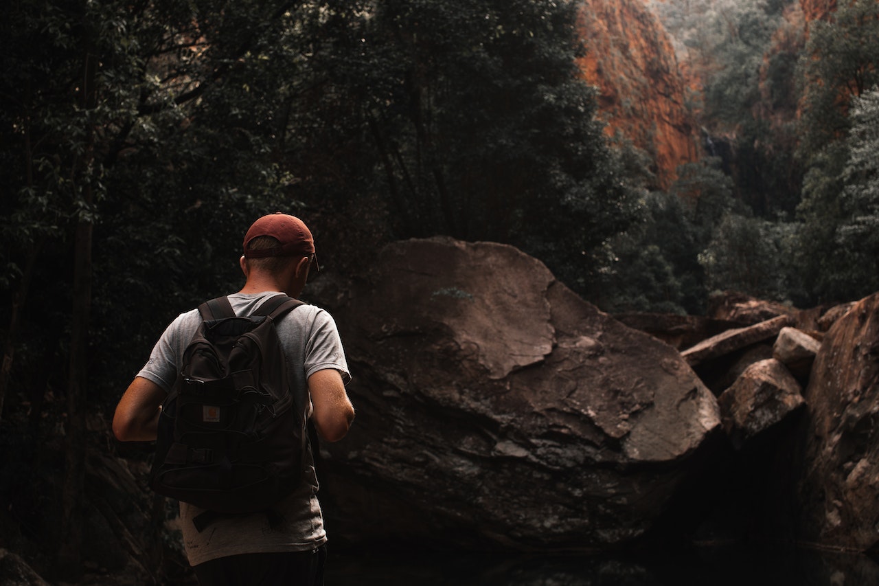 Man walking thru the woods