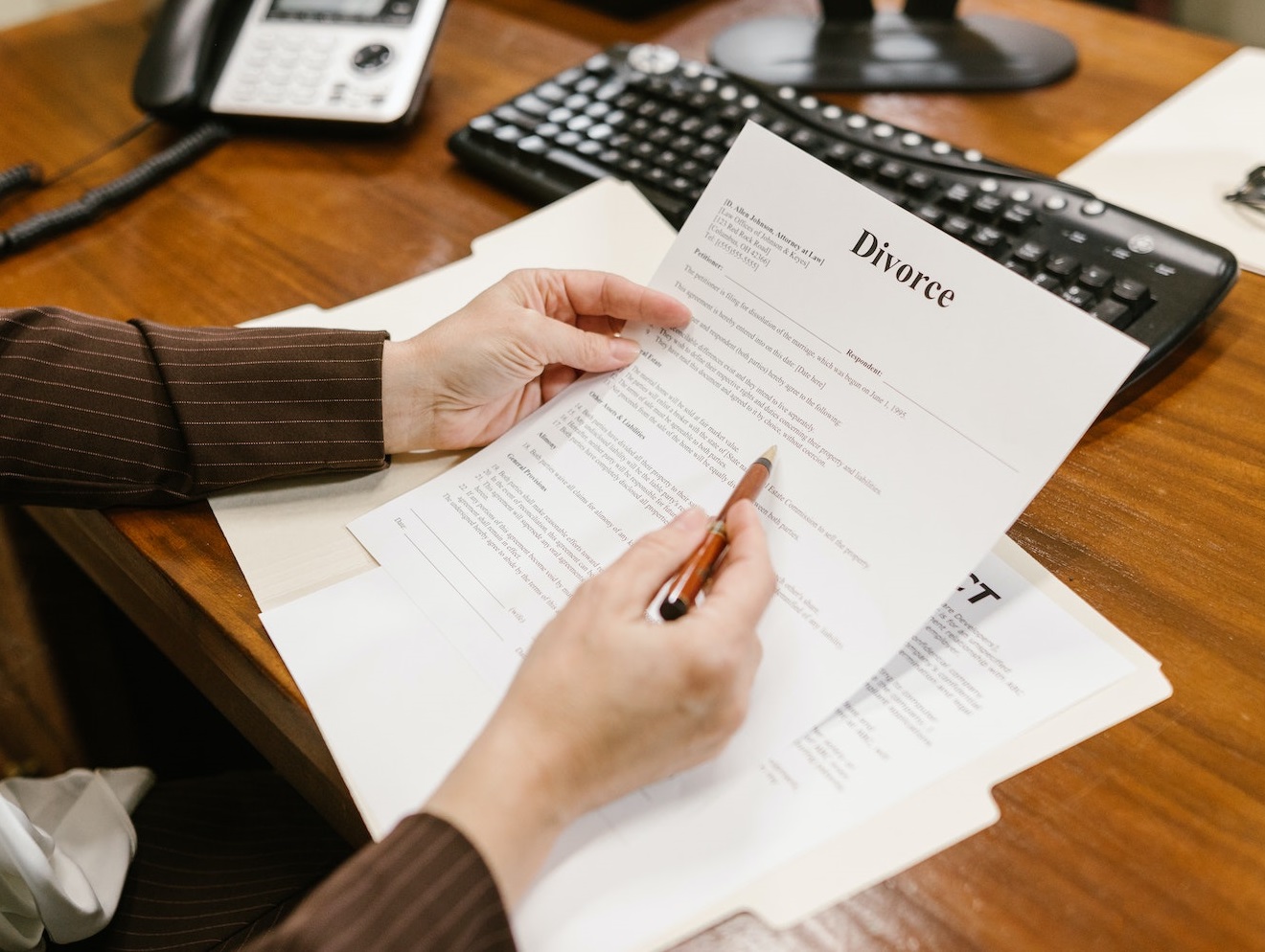woman holding divorce document