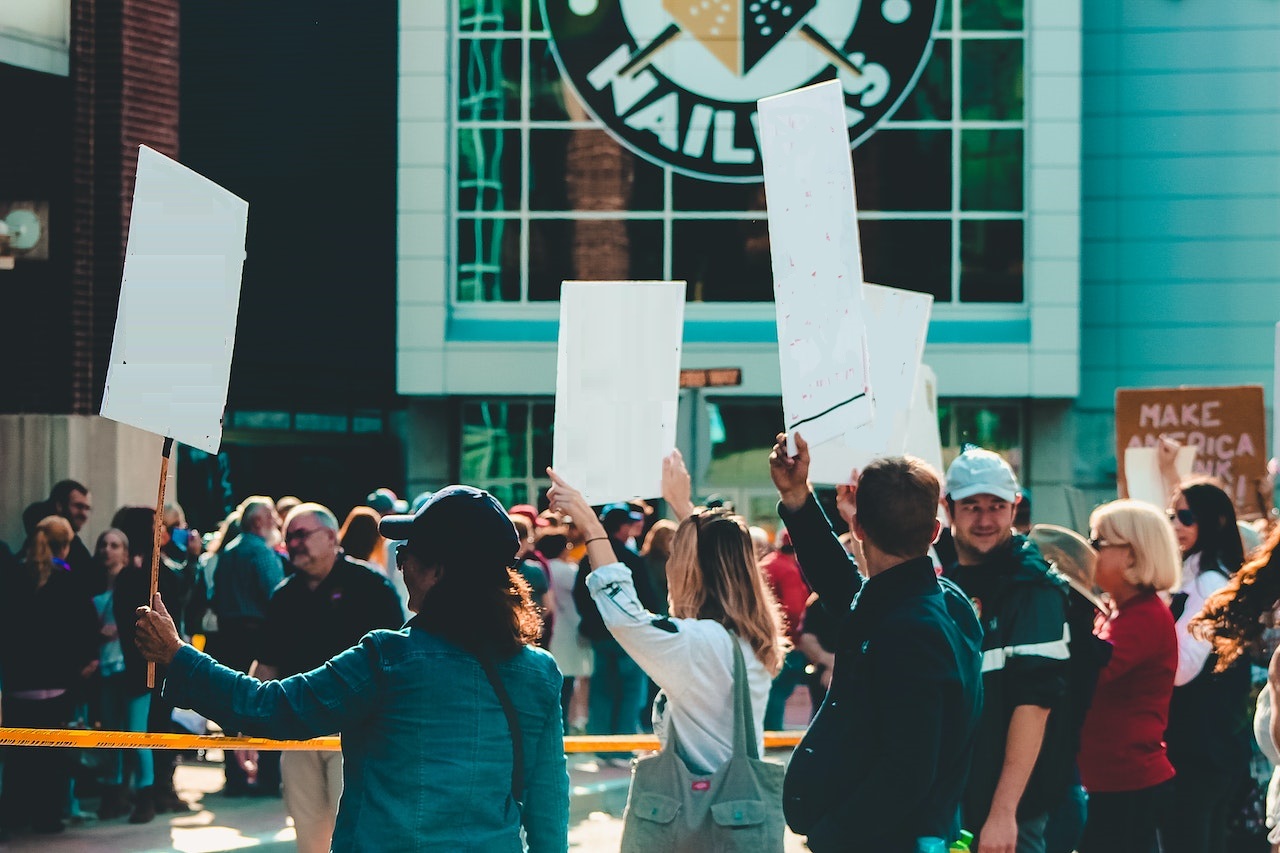People protesting in front of a building.