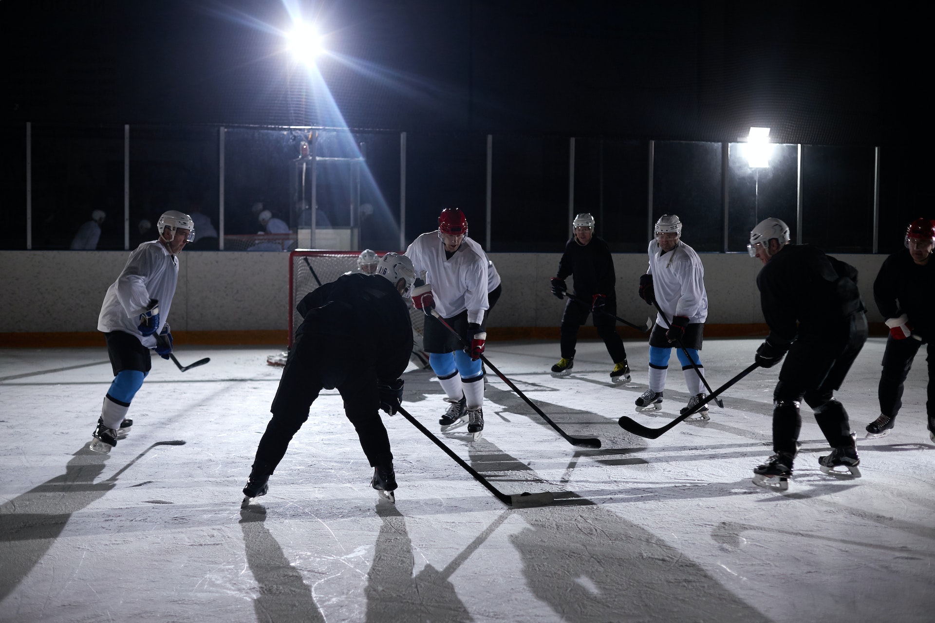 Men playing ice hockey