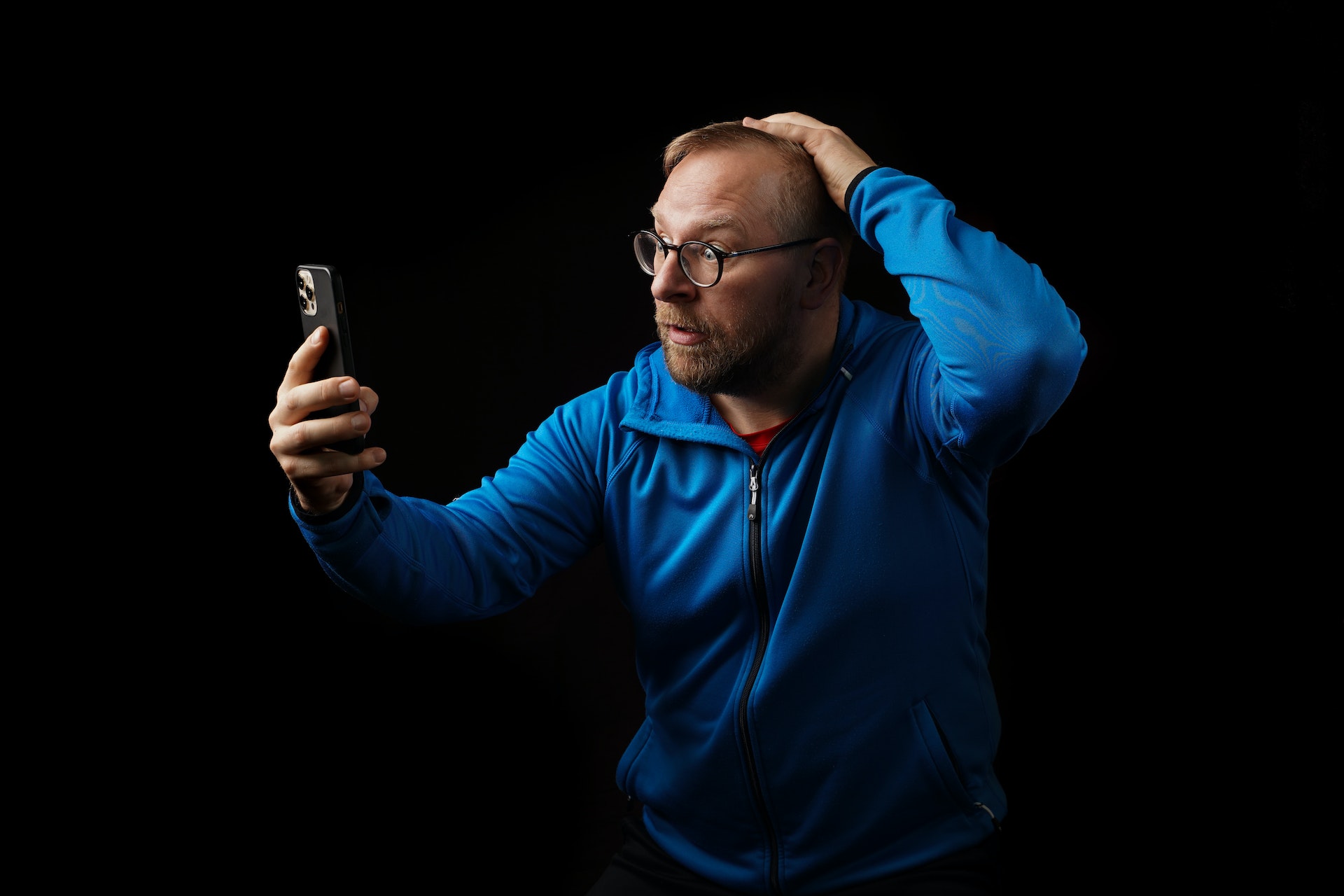 Shocked man looking at a phone
