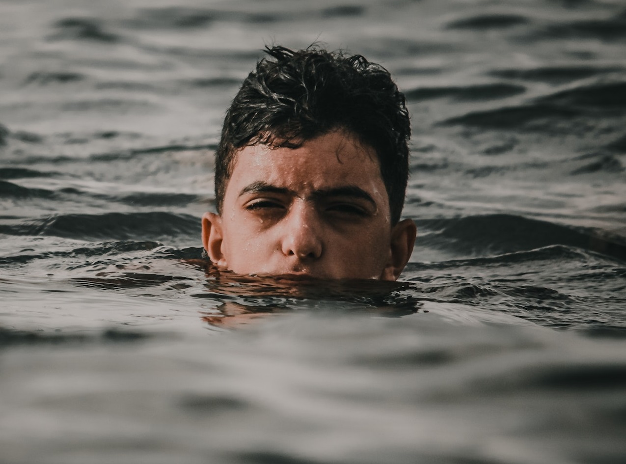 Young kid swimming in the water