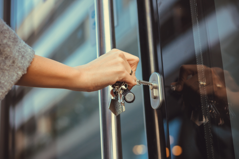 Woman unlocking entrance door