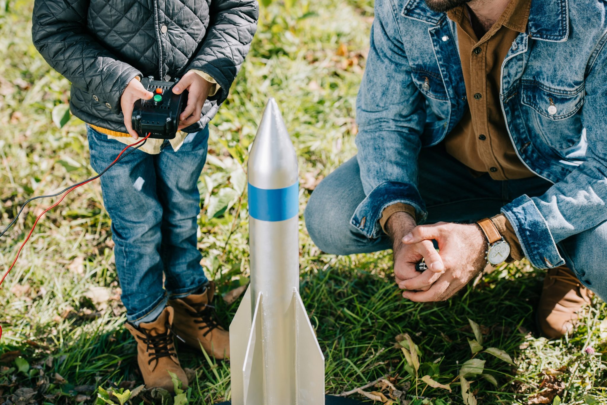 Father and son testing model rocket