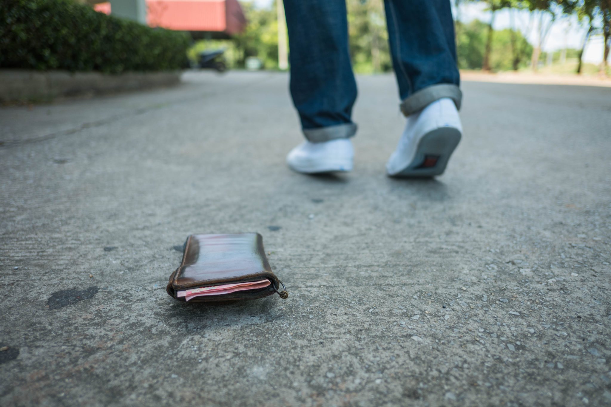 The man had lost brown leather wallet on the street