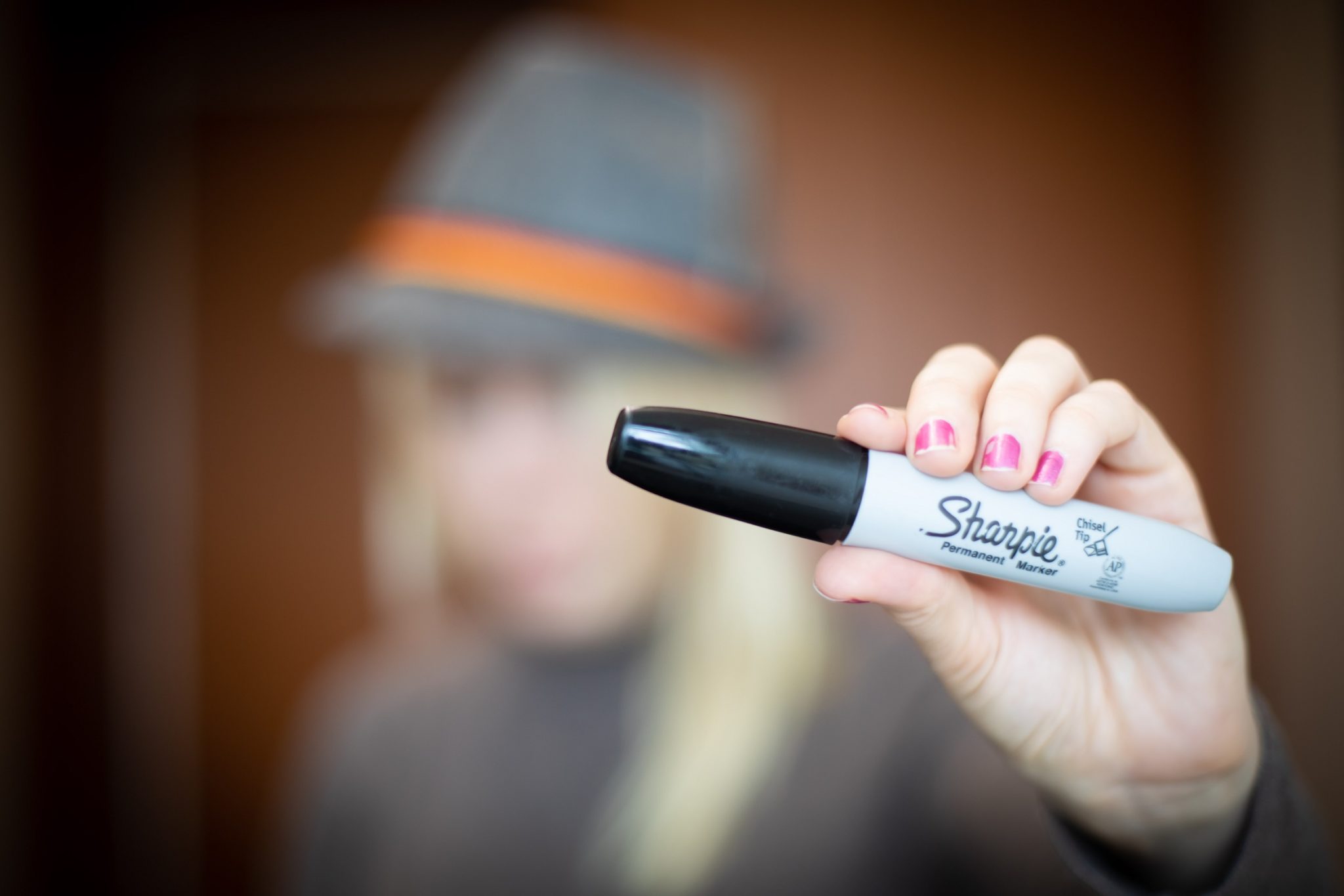 Woman holding a Sharpie