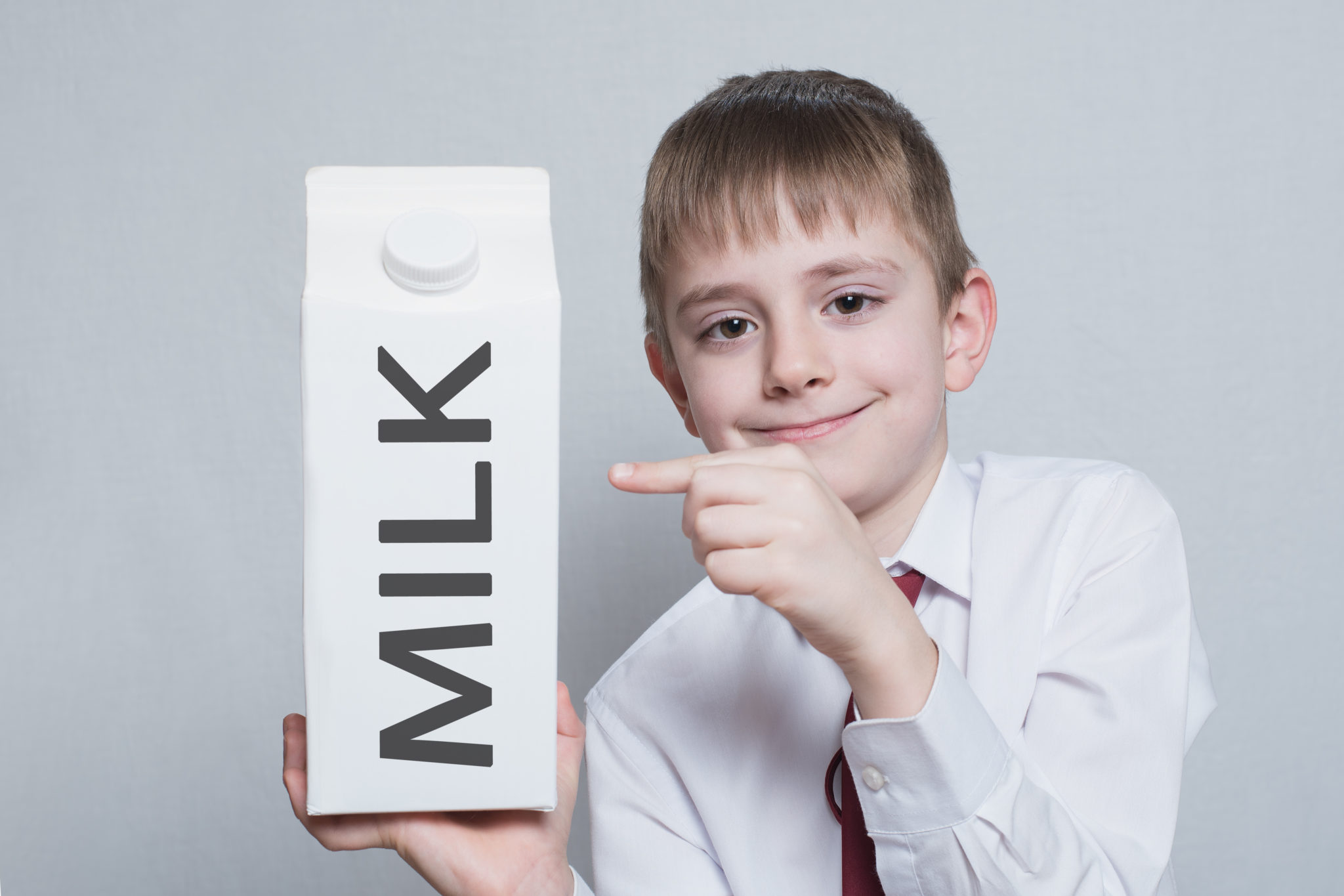 Kid holding a milk carton