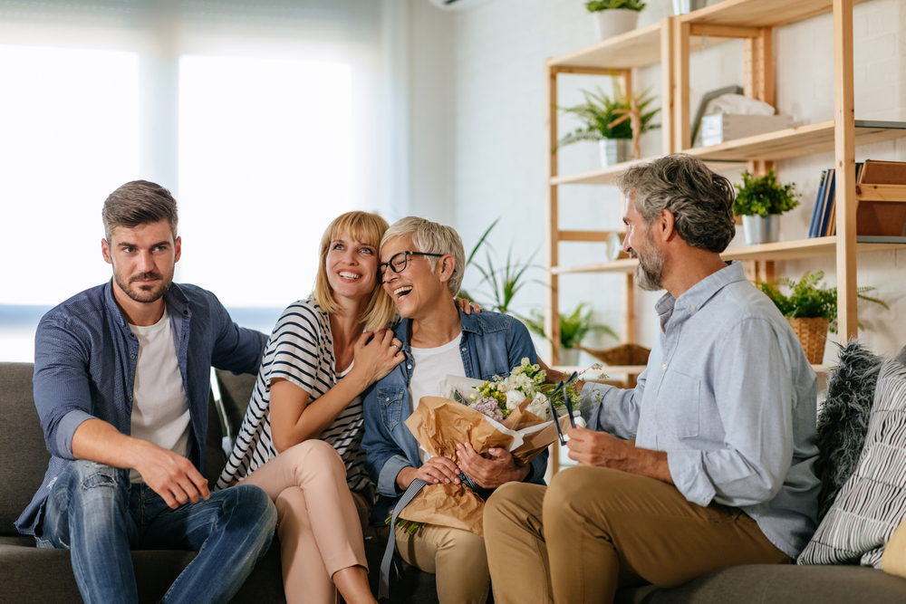 Shocked man in blue shirt meeting his girlfriend's parents