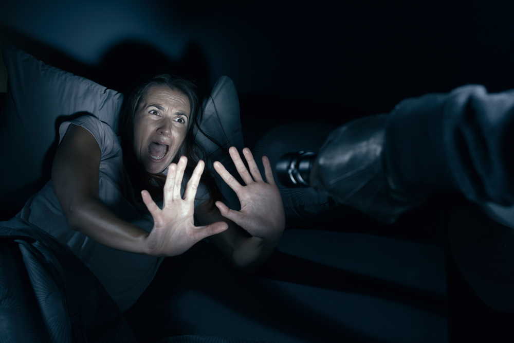 Scared woman woke up to light pointing up to