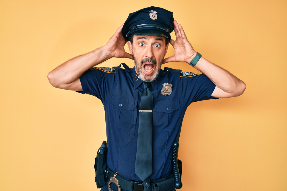 Angry shocked police officer yelling at someone