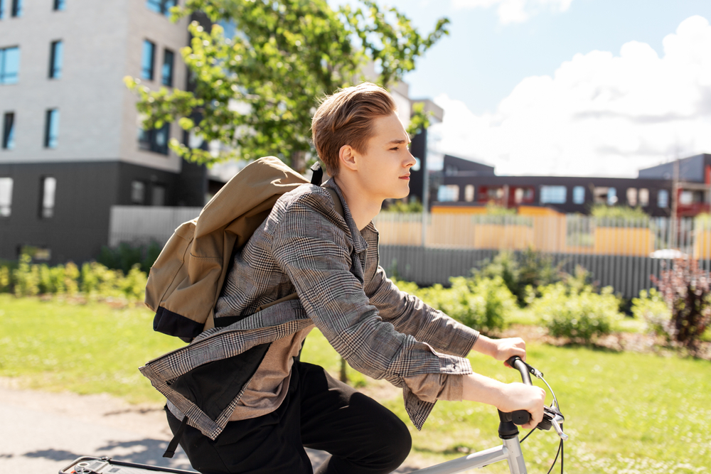 Teenage boy driving a bike