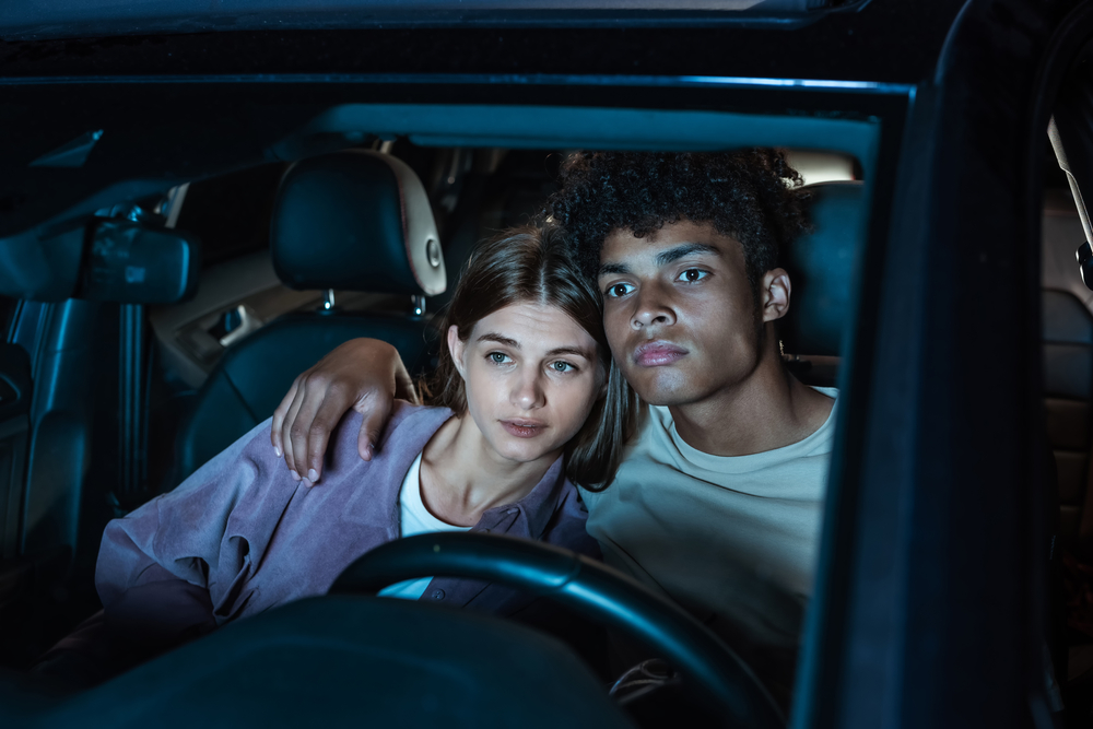 Young couple sitting in a car