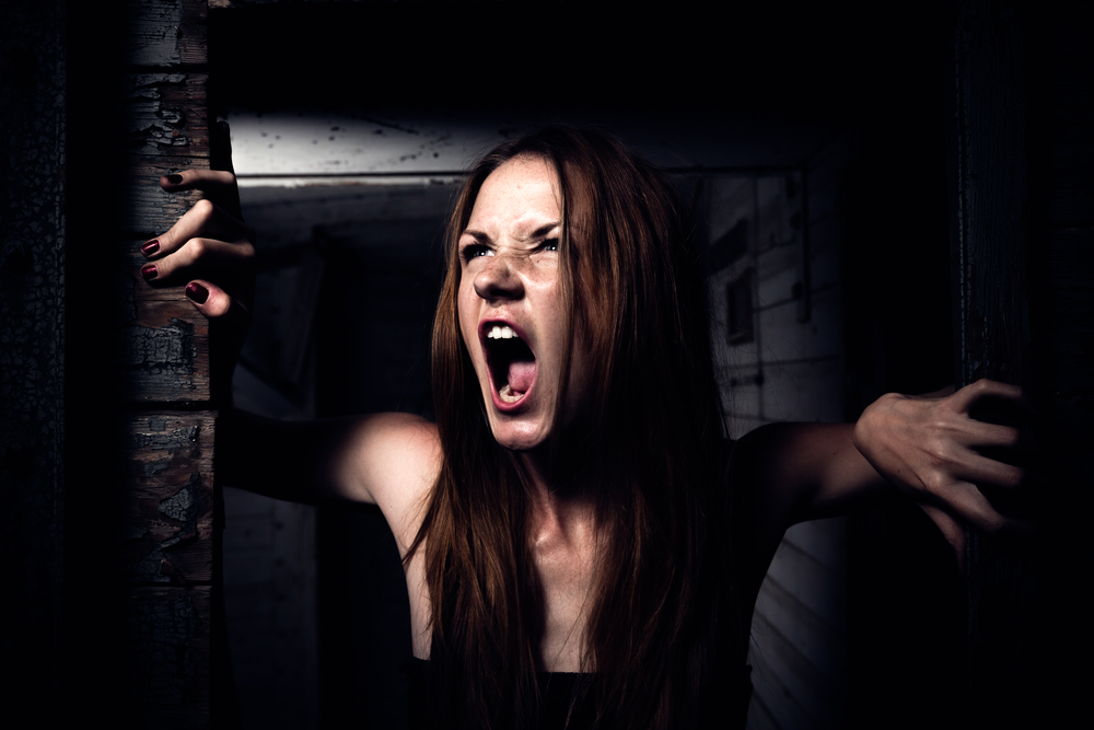 Very angry redhead girl yelling