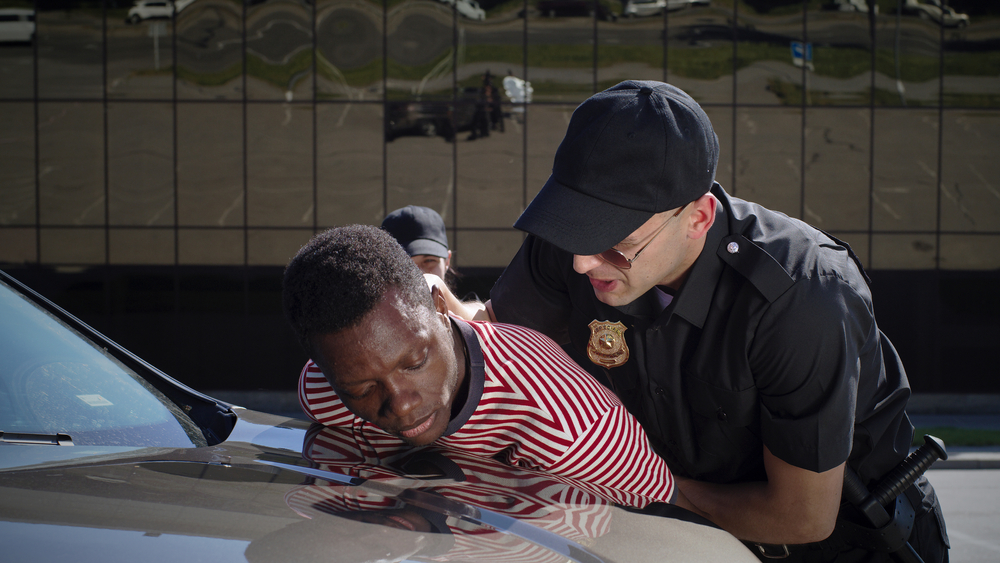 Police officer with gun stopped a man for speeding 