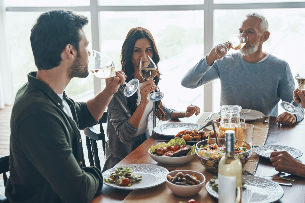 Young couple sitting on a table having dinner