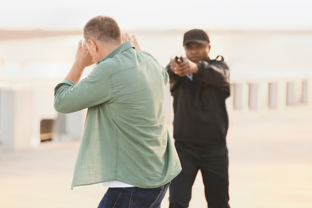 Angry police officer stopped a young man on street