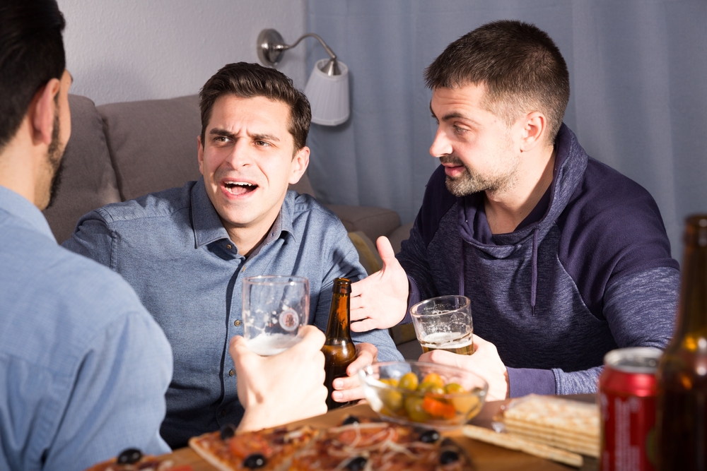 Men drinking and laughing